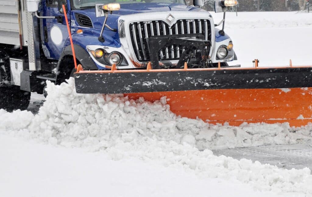 truck moving snow after a storm. when melted it can cause water damage in your home.